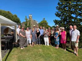 Rotarians, partners and friends enjoying the sunshine